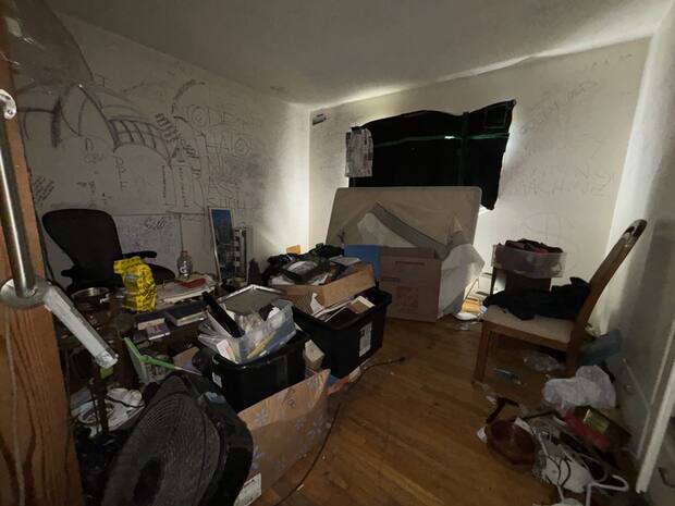 Bedroom cleanout job — boxes and furniture clutter